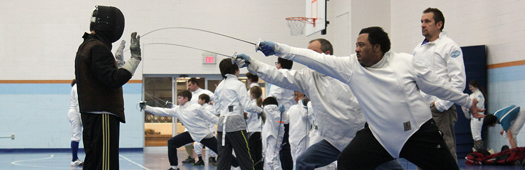 A student lunges during adult classes at Tidewater Fencing Club.