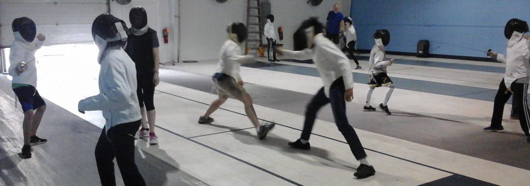 Fencers practicing skills in an Intermediate Class.